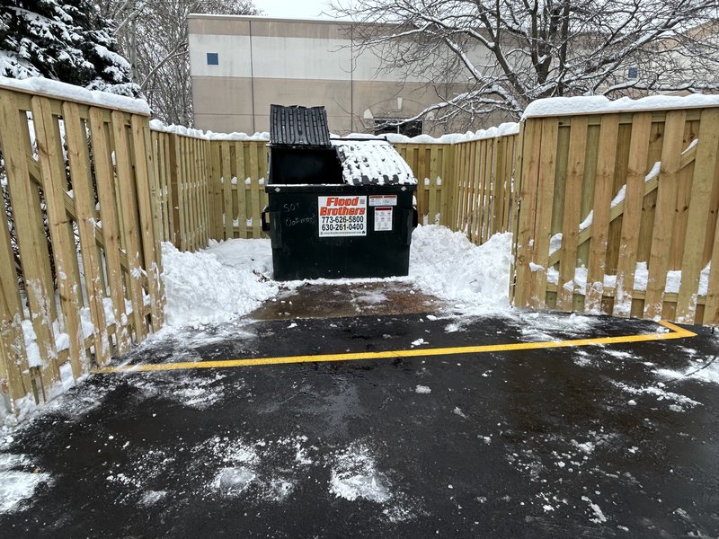 Commercial snow removal in Chicago — cleared pavement at a business after plowing
